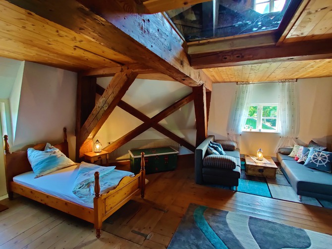 Ferienhaus in Lindau - Windm&uuml;hle Lindaum&uuml;hlenholz - Sitzecke mit Blick in den M&uuml;hlengarten